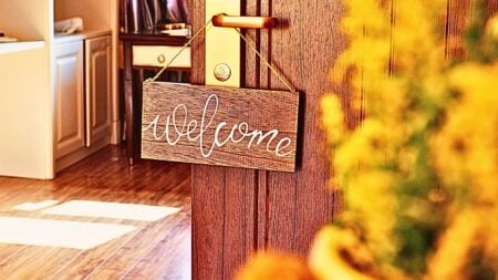 A welcome sign on a front door to symbolize a new agent's guide to home showings