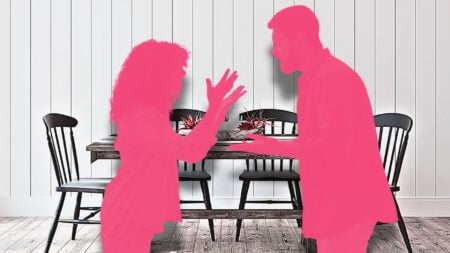 An silhouette of a man and a woman arguing in front of a kitchen table to represent formulating counteroffers to a lowball offer.