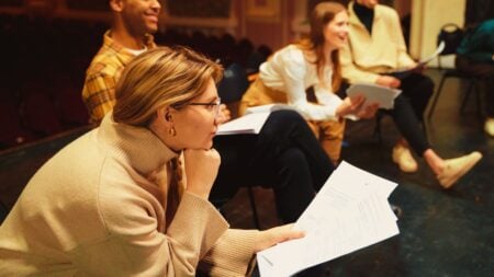 A woman working on memorizing a script to represent canned real estate scripts.