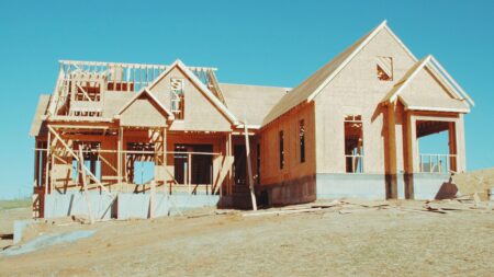 A new home under construction representing new-home sales