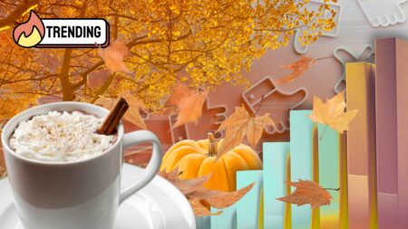 Flat lay of cozy autumn items, including a pumpkin, PSL coffee cup, tree with changing leaves, and leaves swirling — evoking fall marketing trends and seasonal storytelling.