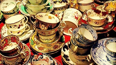 Dozens of tea cups and saucers to represent real estate communication etiquette.