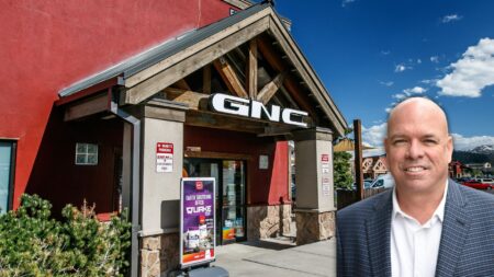 A picture of contributor Jimmy Burgess in front of a GNC store to symbolize his GNC formula for real estate agents.