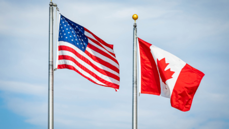 US and Canada flags for story about Canadian tariffs