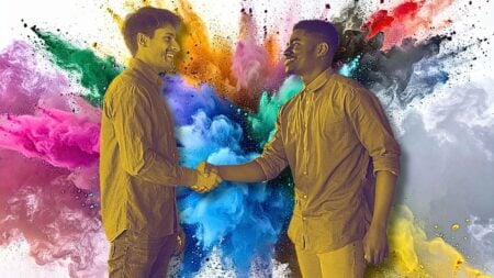 Two people shaking hands in front of an explosion of color to signify media outreach strategies for real estate.