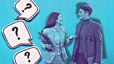 A picture of two business people having a conversation where one is asking the other questions and there are question marks next to them to symbolize recruitment questions.