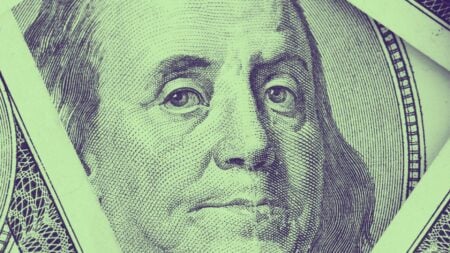 An image of a $100 bill to represent real estate budget truths.