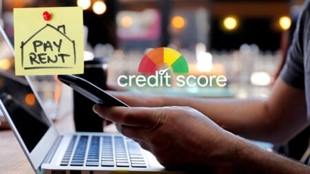 Person checking a credit history graphic on a computer next to a sticky note reading "pay rent," illustrating a factor in mortgage denials