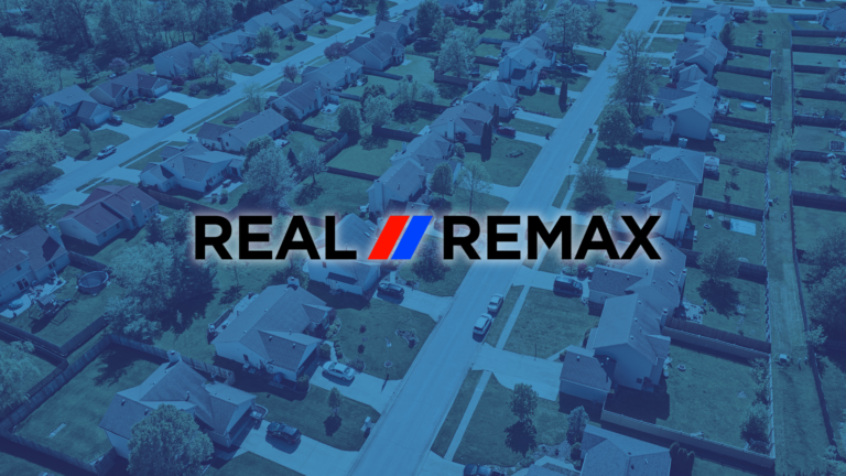 A Real REMAX group logo over an image of a neighborhood to signify the Real REMAX merger.