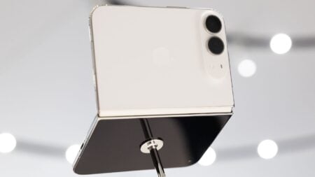 iPhone Duo unfolded in star white, showing the larger screen real estate agents could use for listing photos and multitasking