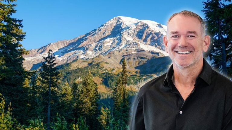 An image of OB Jacobi in front of a Washington mountain to symbolize the Compass-NWMLS settlement.