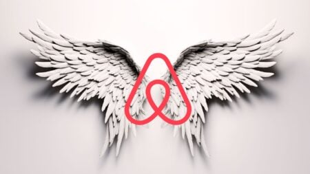 An image of angel wings with the Airbnb logo as the body to represent whether the Airbnb $250 million housing fund will be the angel or devil of housing supply.