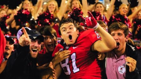 An image of college football players to represent real estate NIL moment.