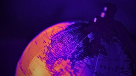 Globe illustration representing real estate brokerages expanding into new markets around the world.
