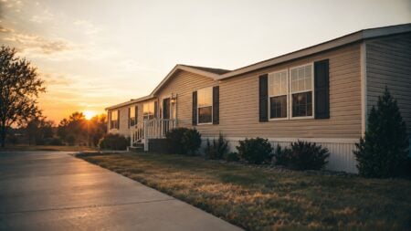 A single-story manufactured home on a residential lot, illustrating a story on manufactured housing zoning